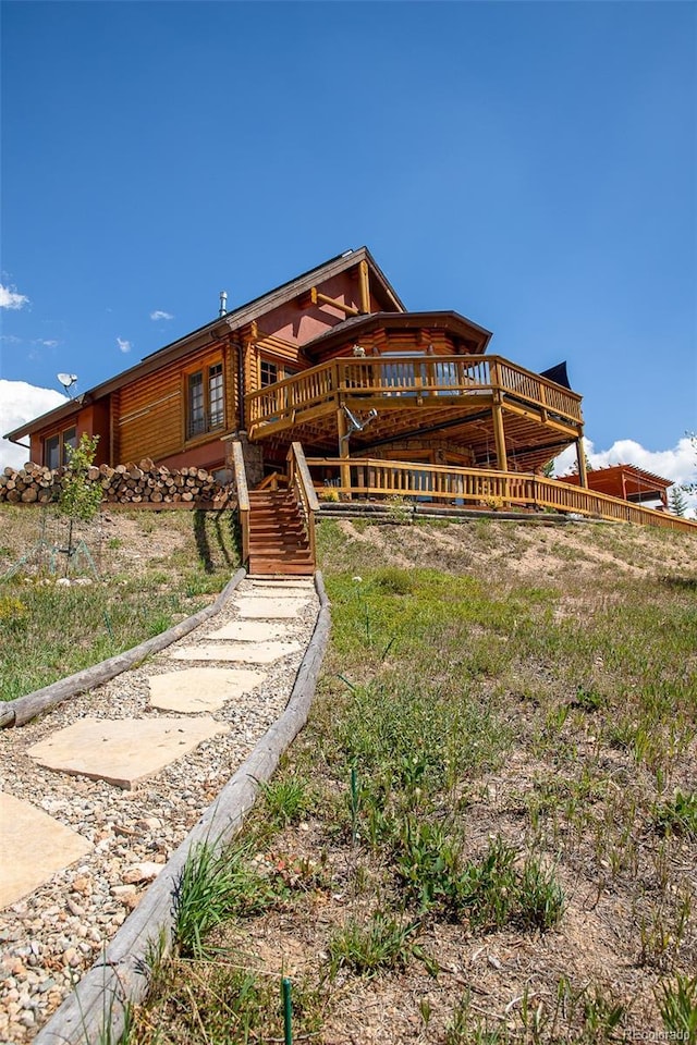 view of front of property with a wooden deck