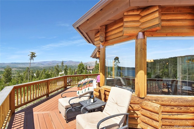 wooden terrace featuring a mountain view