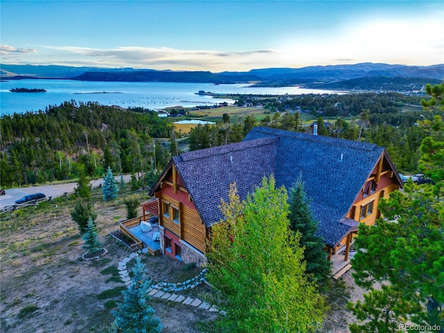 aerial view at dusk with a water and mountain view