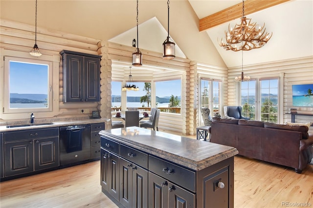 kitchen with high vaulted ceiling, a sink, black dishwasher, beamed ceiling, and an inviting chandelier