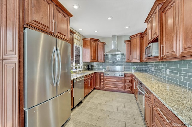12646 S Dove Creek Way, Parker, CO 80134 - kitchen featuring appliances with stainless steel finishes, wall chimney exhaust hood, light stone countertops, a sink, and backsplash