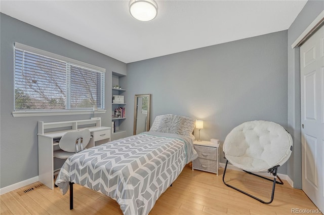 12646 S Dove Creek Way, Parker, CO 80134 - bedroom featuring light wood-type flooring and baseboards