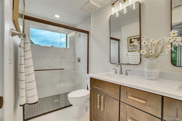 full bath with visible vents, toilet, tile patterned floors, vanity, and a shower stall