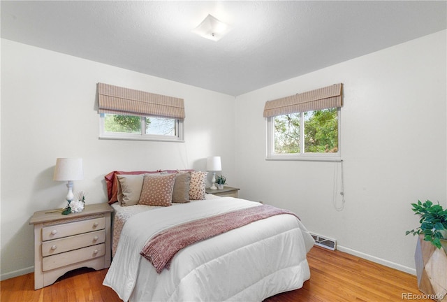 3700 Indianpipe Cir, Colorado Springs, CO 80918 - bedroom with baseboards and wood finished floors
