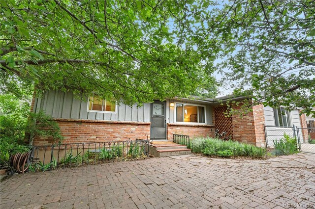 3700 Indianpipe Cir, Colorado Springs, CO 80918 - view of front facade featuring board and batten siding and brick siding
