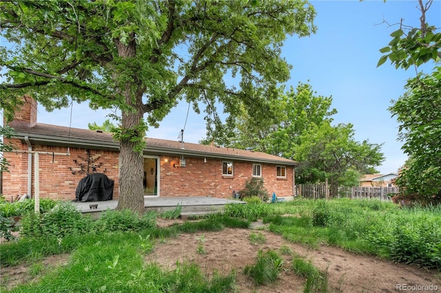 3700 Indianpipe Cir, Colorado Springs, CO 80918 - back of property with brick siding, a chimney, and a patio area