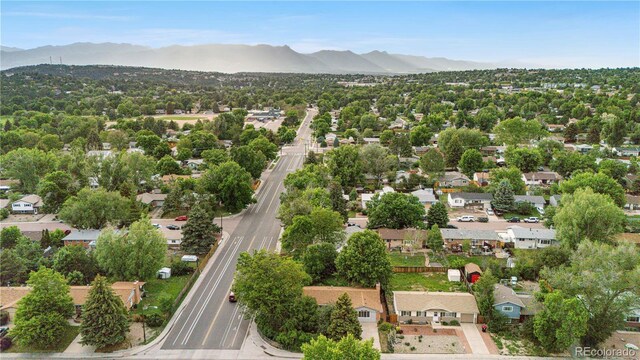3700 Indianpipe Cir, Colorado Springs, CO 80918 - aerial view of property and surrounding area featuring a mountainous background and nearby suburban area