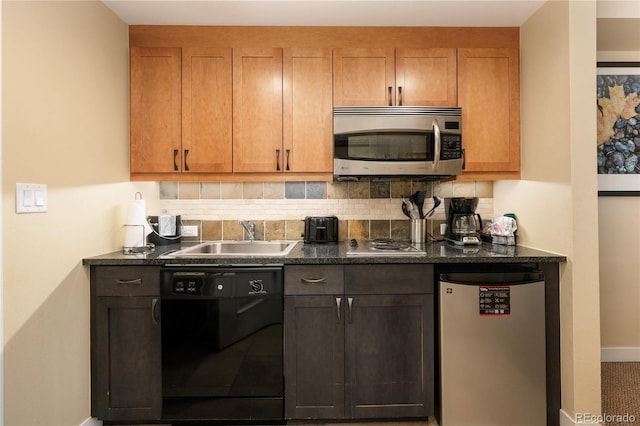 kitchen with sink, backsplash, and stainless steel appliances