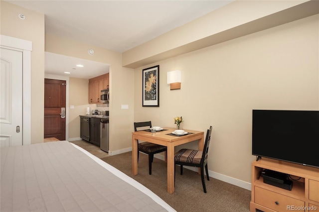 dining area featuring carpet