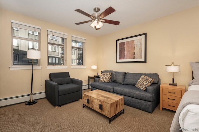 carpeted living room with ceiling fan and baseboard heating