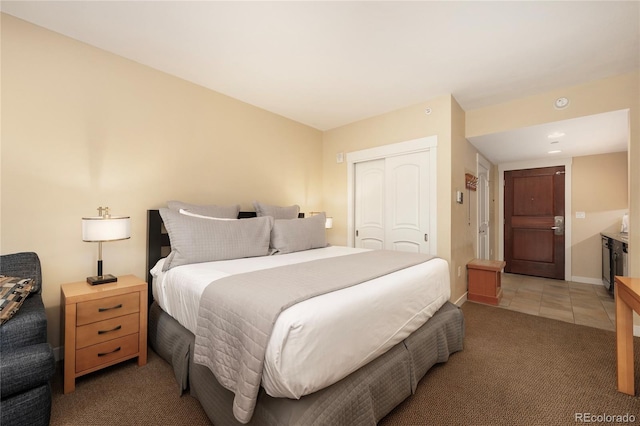 bedroom with a closet and carpet flooring