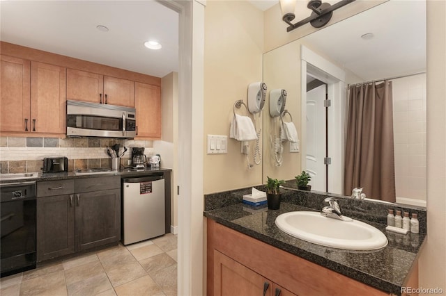 bathroom with decorative backsplash and vanity