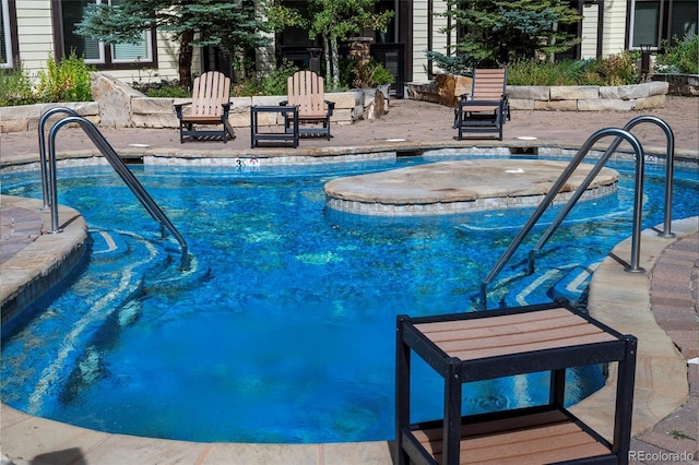 view of pool featuring a patio area