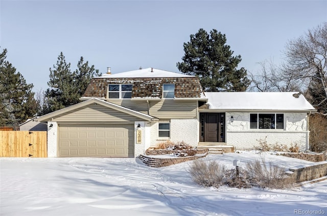 view of front of property featuring a garage