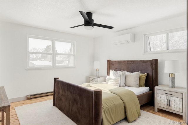 bedroom featuring ceiling fan, a wall mounted AC, baseboard heating, and multiple windows