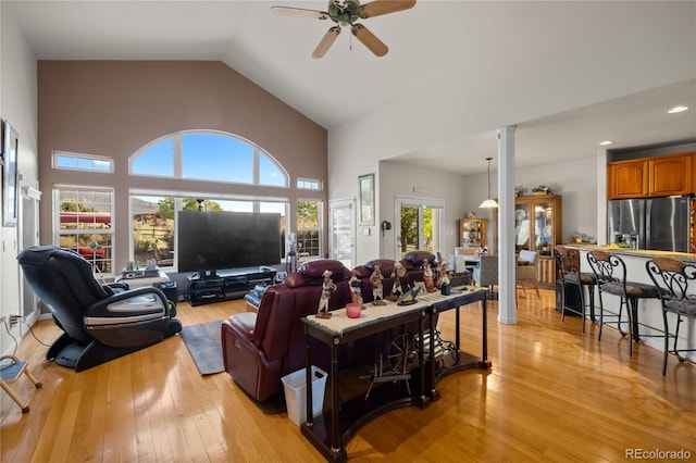 332 Battlement Creek Trl, Parachute, CO 81635 - living room featuring a ceiling fan, light wood finished floors, high vaulted ceiling, and recessed lighting