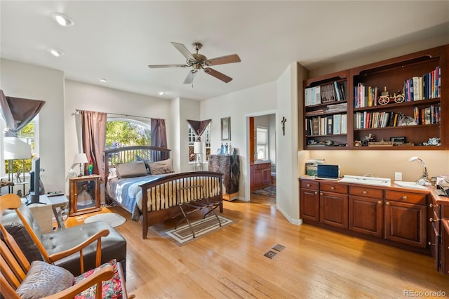 332 Battlement Creek Trl, Parachute, CO 81635 - bedroom with light wood-style floors, recessed lighting, and connected bathroom