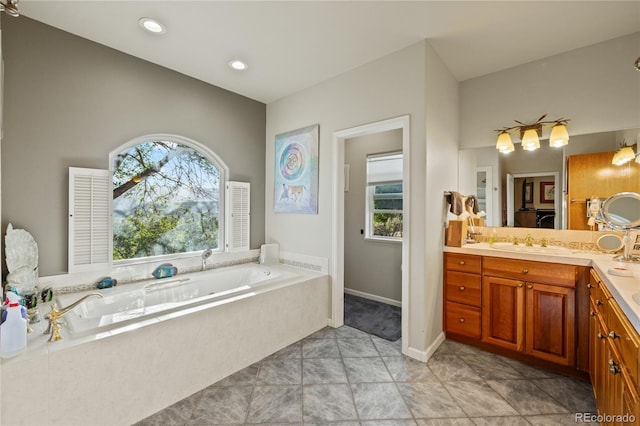 332 Battlement Creek Trl, Parachute, CO 81635 - bathroom featuring a garden tub and vanity