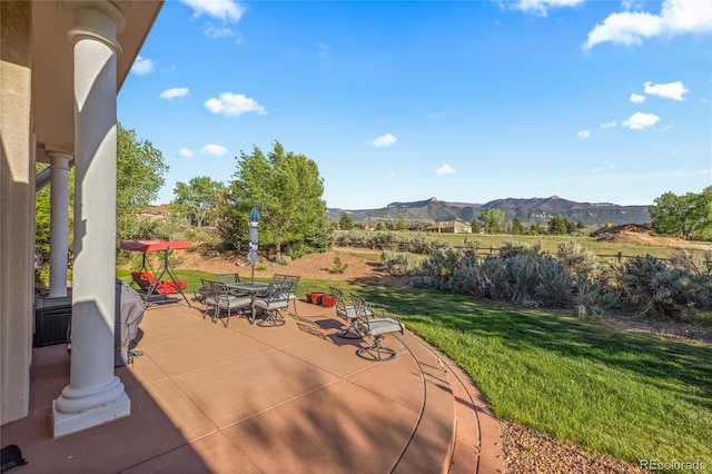 332 Battlement Creek Trl, Parachute, CO 81635 - view of patio / terrace with a mountain view and outdoor dining space