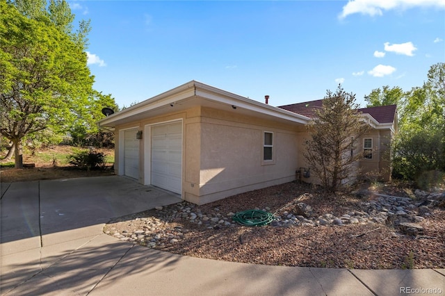 332 Battlement Creek Trl, Parachute, CO 81635 - view of side of home with a detached garage