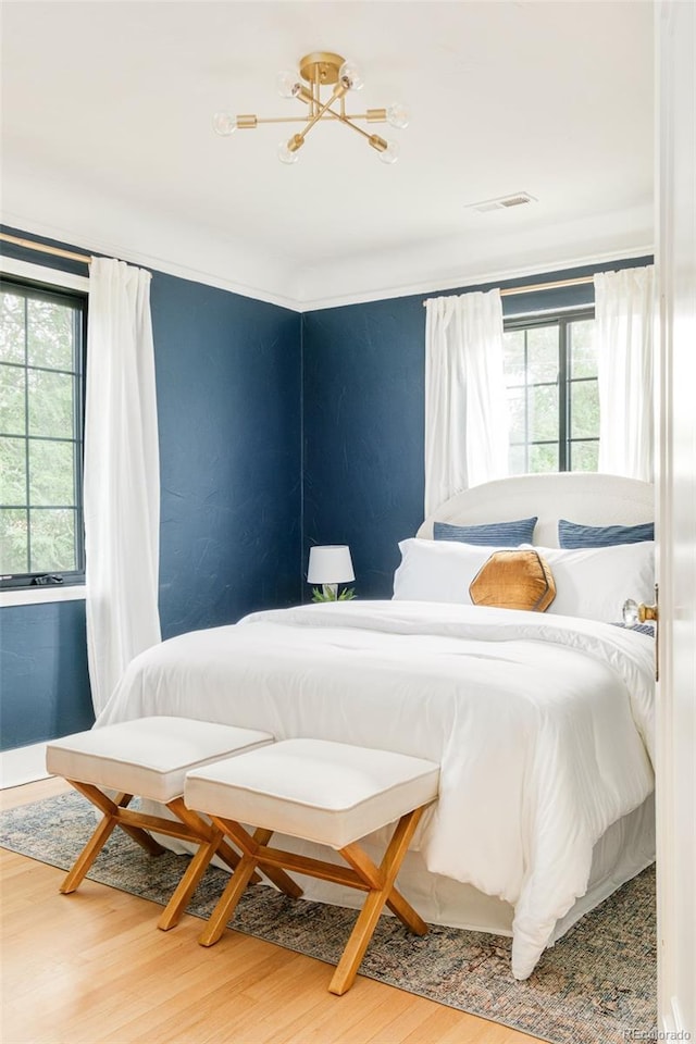 1300 N Glencoe St, Denver, CO 80220 - bedroom featuring wood finished floors and baseboards