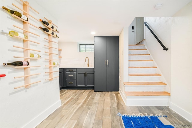 1300 N Glencoe St, Denver, CO 80220 - bar featuring light wood finished floors and stairway