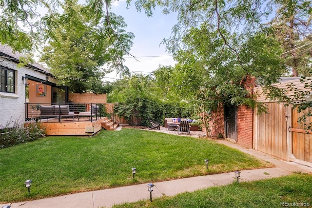 1300 N Glencoe St, Denver, CO 80220 - view of yard with an outdoor living space and a wooden deck