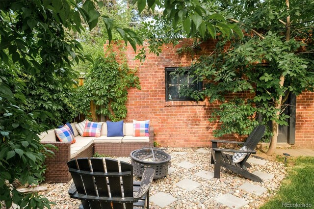 1300 N Glencoe St, Denver, CO 80220 - view of patio with an outdoor living space with a fire pit
