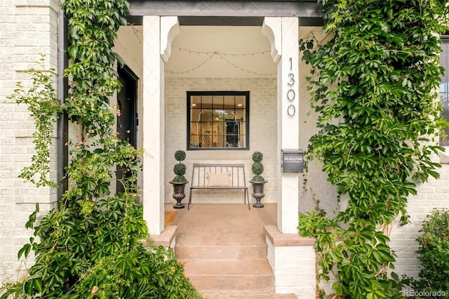 1300 N Glencoe St, Denver, CO 80220 - entrance to property with a porch and brick siding