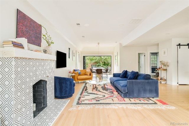 1300 N Glencoe St, Denver, CO 80220 - living room with wood finished floors and a tiled fireplace
