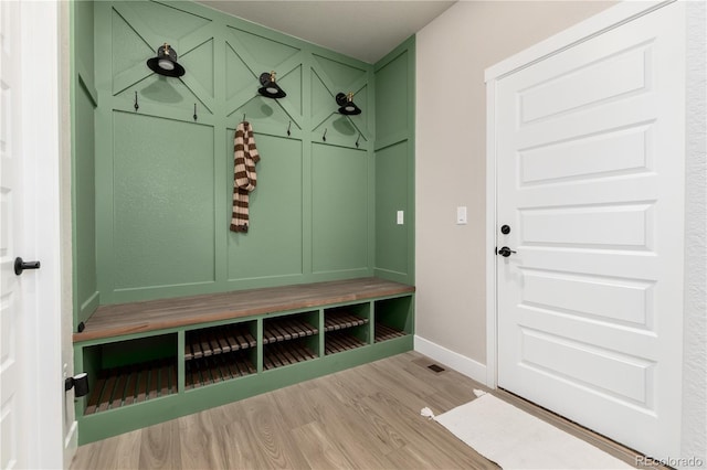 mudroom with light hardwood / wood-style floors