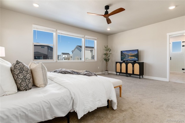 carpeted bedroom featuring ceiling fan