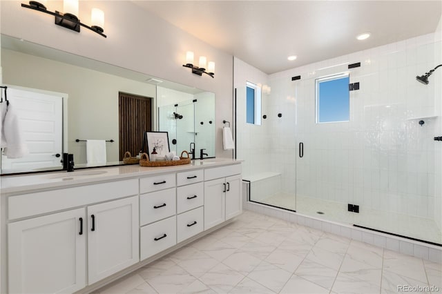 bathroom featuring walk in shower and vanity