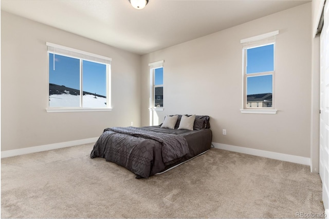 bedroom with light colored carpet