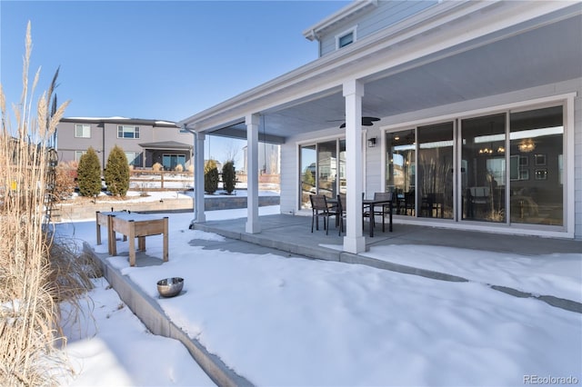 snow covered patio with ceiling fan