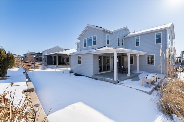 view of snow covered house