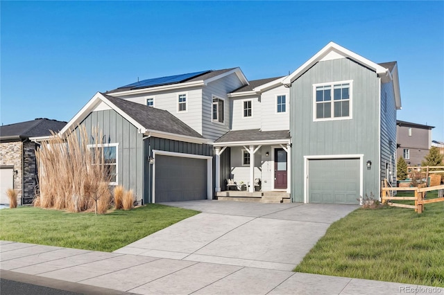 view of front of home featuring a garage and a front yard