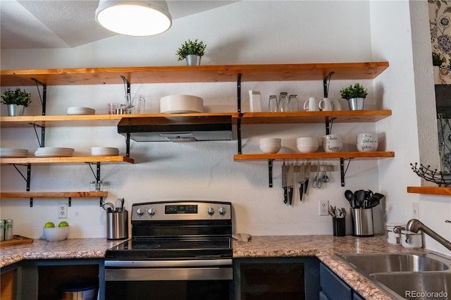 kitchen with stainless steel range with electric stovetop, a sink, open shelves, and extractor fan