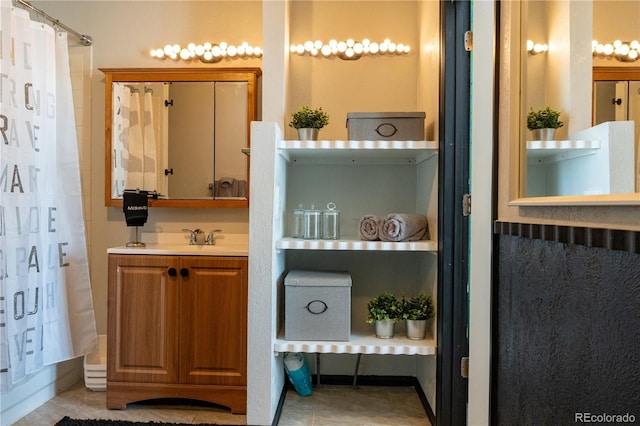 full bathroom featuring vanity