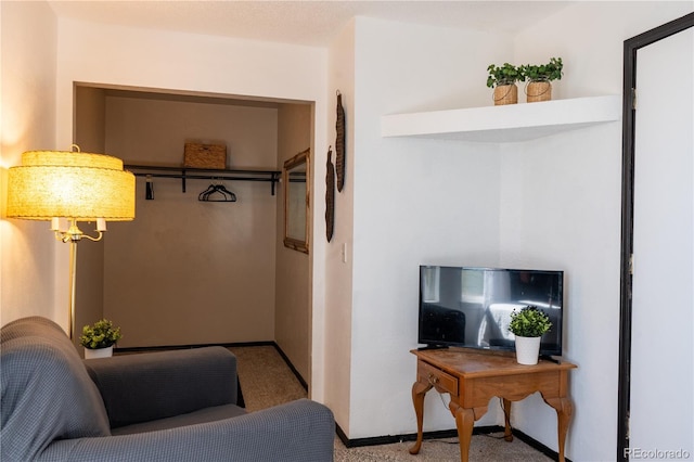 interior space featuring light colored carpet and baseboards