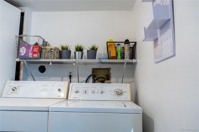 clothes washing area with laundry area and washing machine and clothes dryer