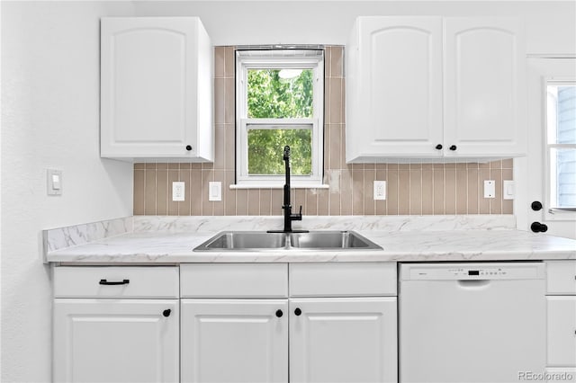 4556 S Pagosa Way, Aurora, CO 80015 - kitchen with dishwasher, a sink, backsplash, and white cabinetry