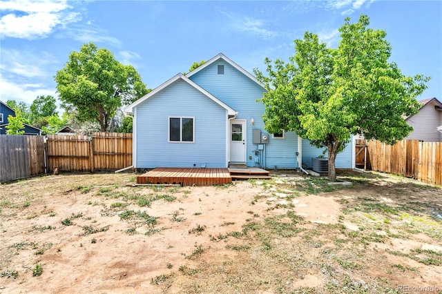 4556 S Pagosa Way, Aurora, CO 80015 - back of house featuring a fenced backyard, a deck, and cooling unit