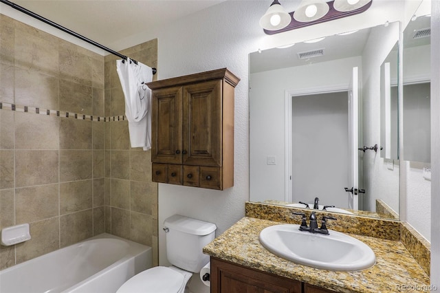 full bathroom featuring shower / bath combo with shower curtain, vanity, and toilet