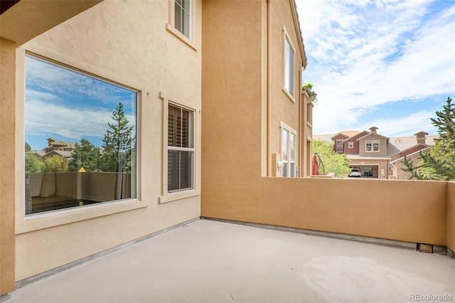 view of patio featuring a balcony