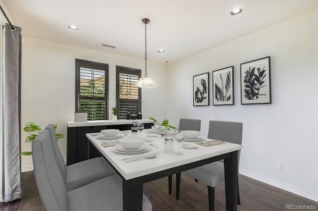 dining area featuring dark hardwood / wood-style floors