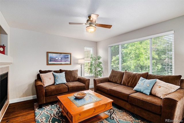 735 Poppy Pl, Highlands Ranch, CO 80129 - living room featuring a ceiling fan, wood finished floors, and a fireplace