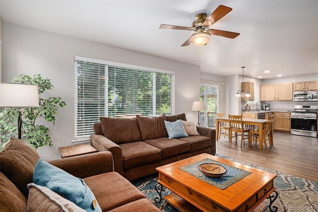 735 Poppy Pl, Highlands Ranch, CO 80129 - living area featuring a ceiling fan, wood finished floors, and recessed lighting