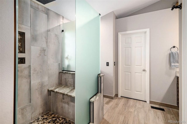 735 Poppy Pl, Highlands Ranch, CO 80129 - full bath featuring a walk in shower, wood finished floors, and lofted ceiling