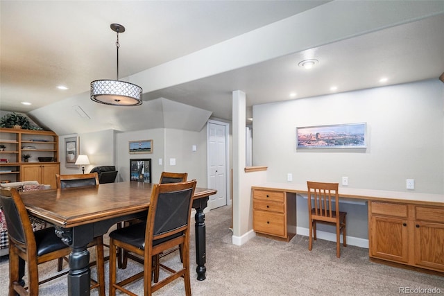 735 Poppy Pl, Highlands Ranch, CO 80129 - dining space featuring light carpet, vaulted ceiling, built in study area, and recessed lighting